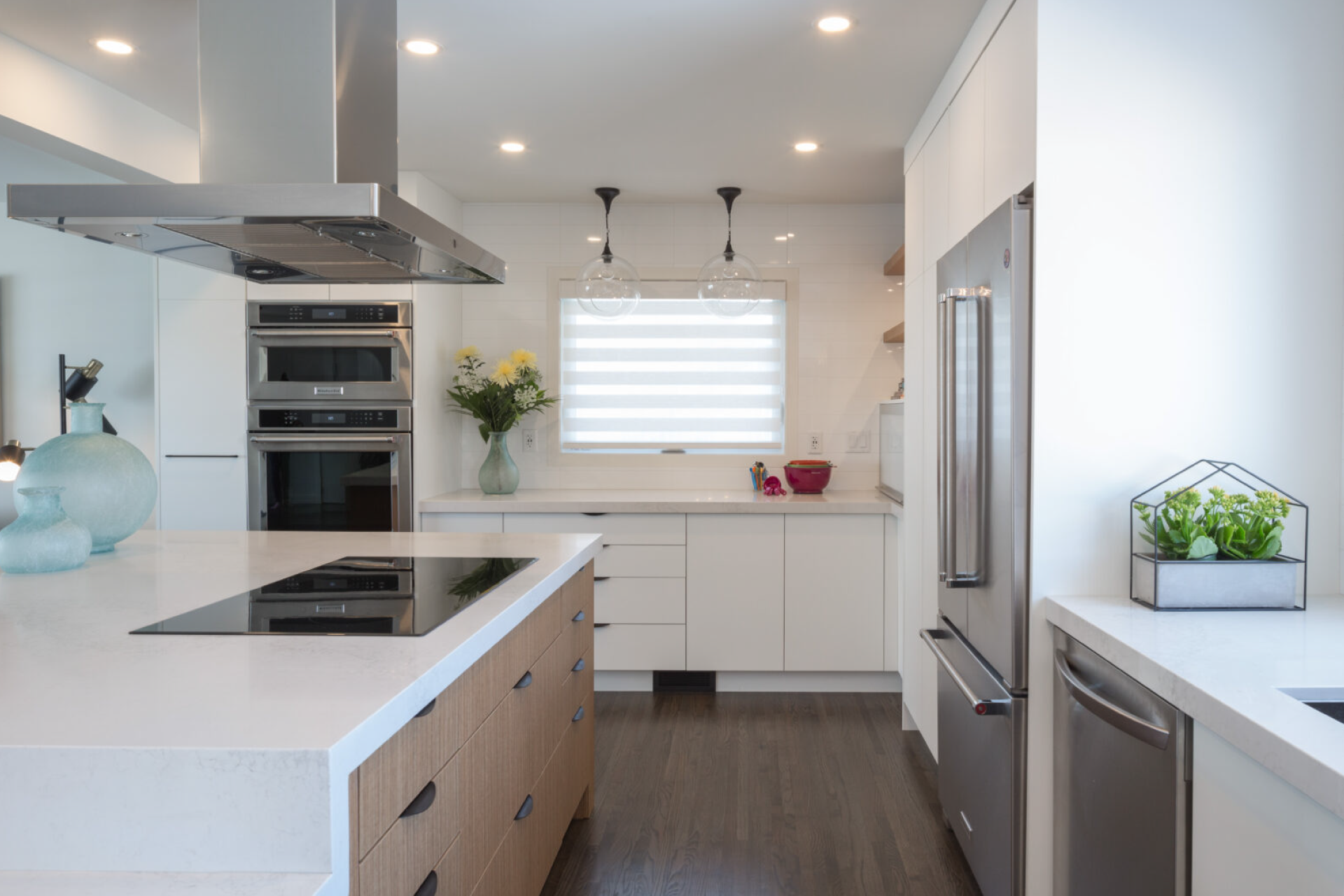 Modern kitchen with large island and built in range.