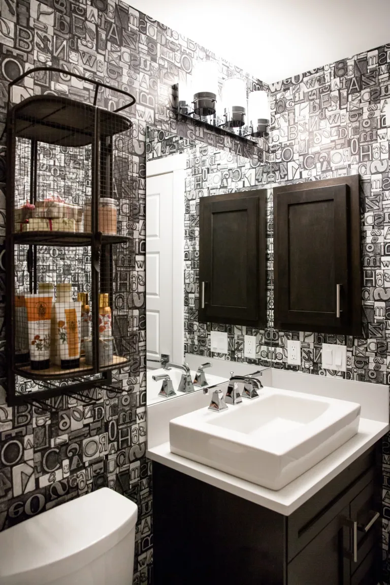 Masculine guest bathroom wallpaper.