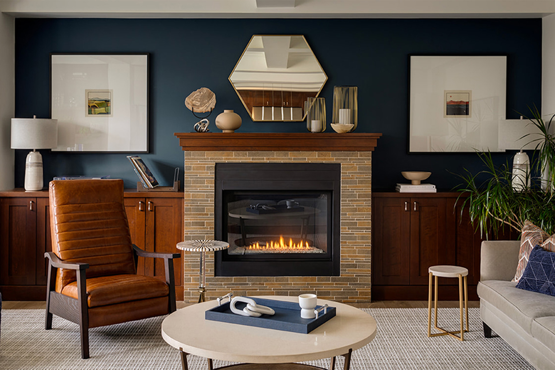 A traditional brick fireplace surrounded by modern brown and blue decor.