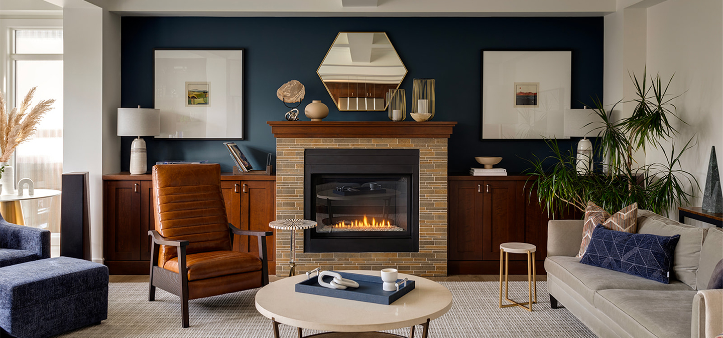 A newly renovated living space with the original brick fireplace and modern decor.